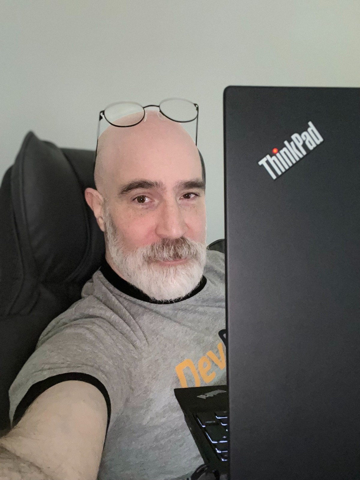 Portrait of Eli Fadi with a ThinkPad laptop